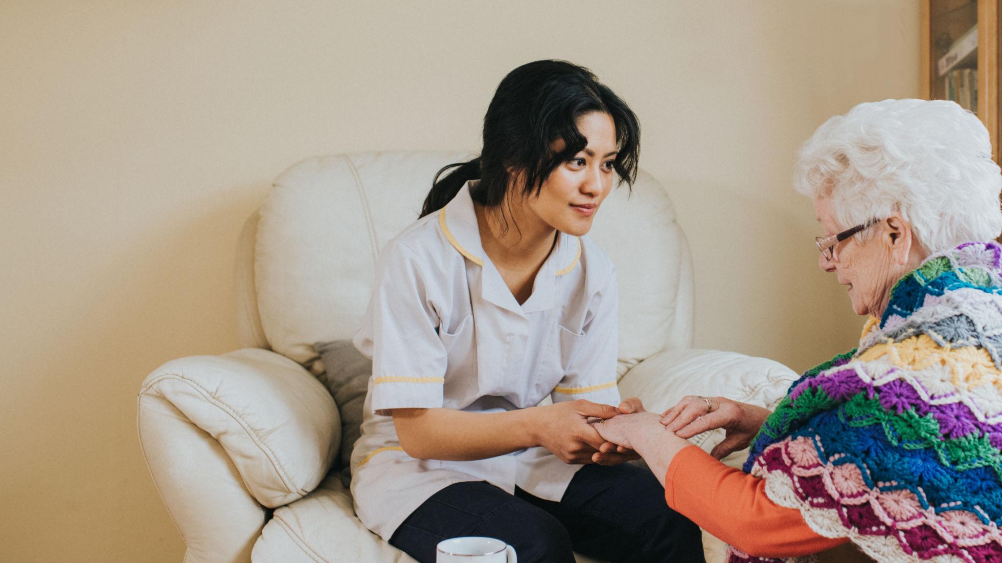 Care staff working together to support a resident with compassion and structure